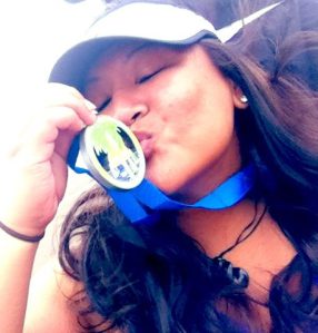 The picture I sent to my doctors...me and my signature pose kissing my medal after my first marathon. 